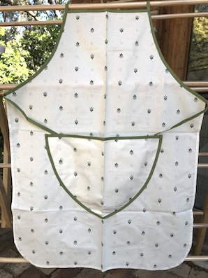 french coated apron in beige tones