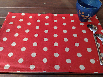 red coated placemats with spots